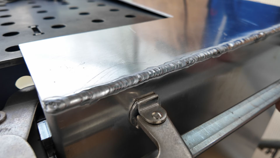 A row of amateur aluminium TIG weld
