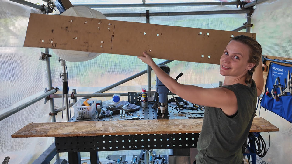 Hayley holds up her finished chassis mounting template