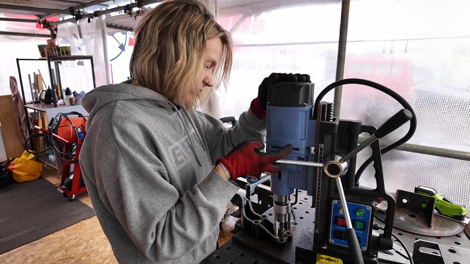 Hayley drilling holes for an adapter plate