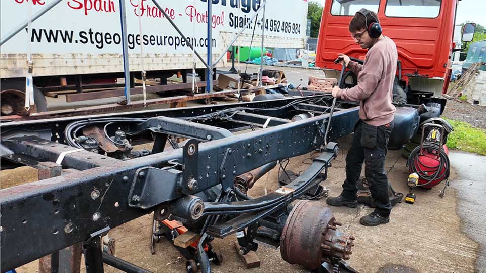 Pete removing the old leaf springs from our chassis