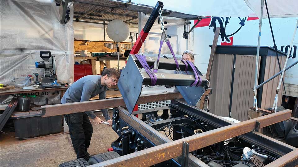 Lifting the fifth wheel mount with a crane