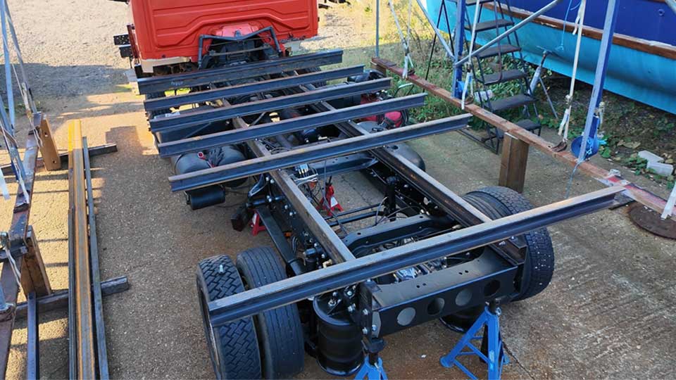 Custom truck flatbed design with crossmembers tacked in place