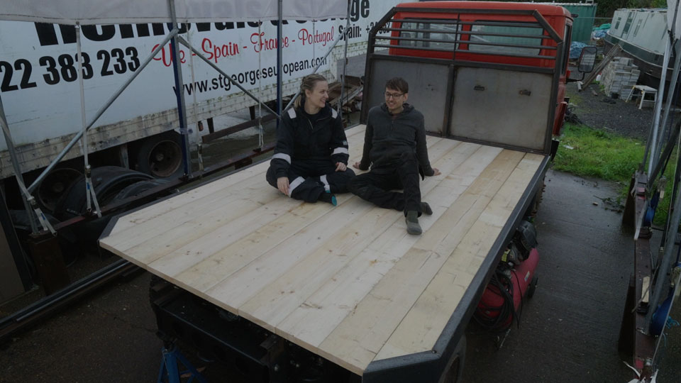 Hayley and Pete sitting on board their finished truck flatbed
