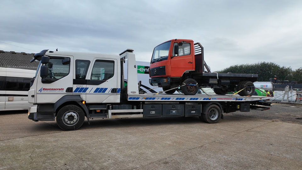 Mercedes 814 on the back of an HGV transporter