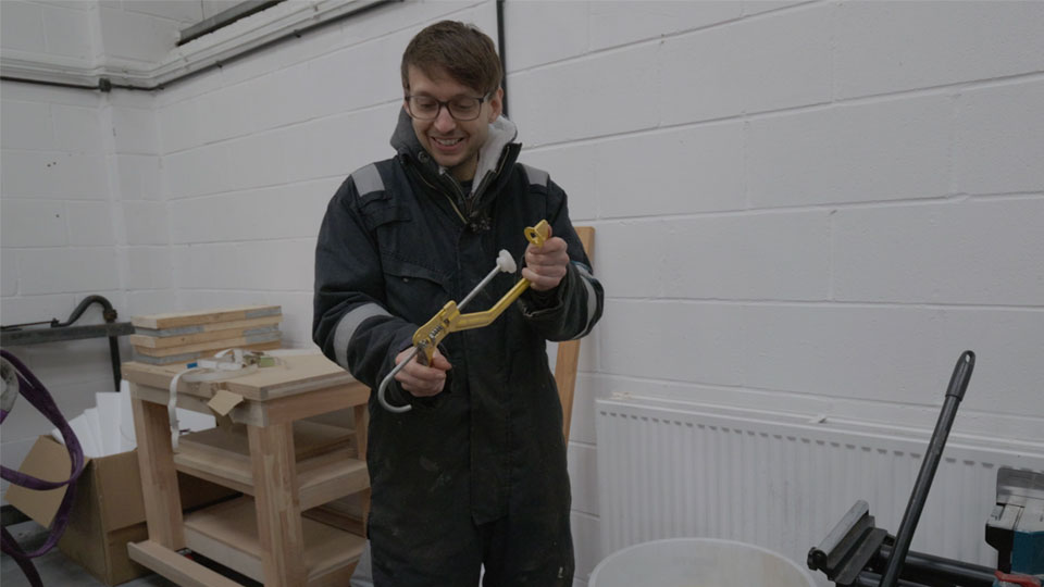 Pete holding some kind of clamp