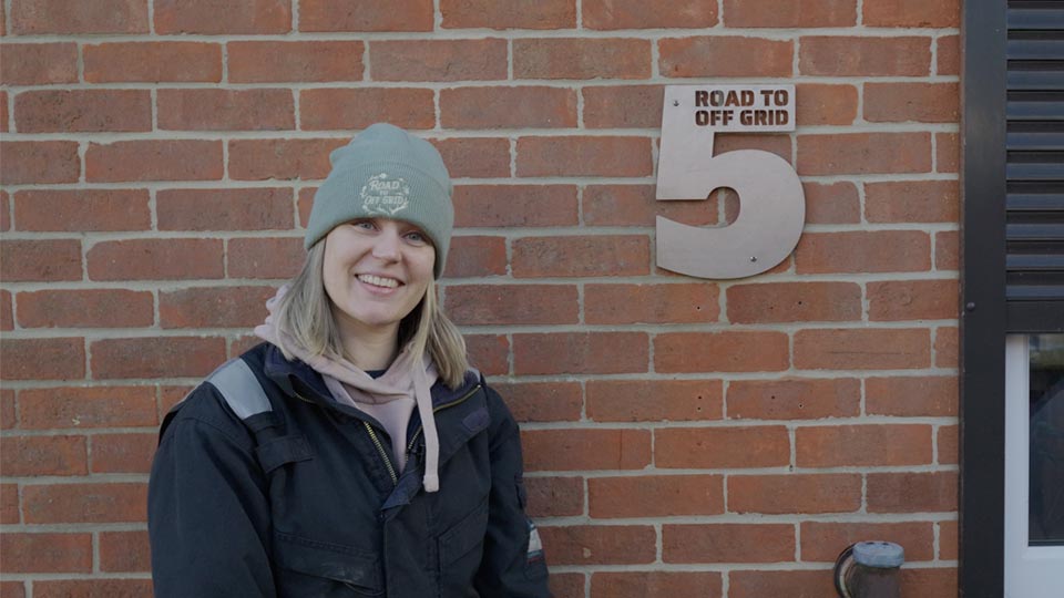 Hayley poses with her freshly laser CNC cut door number