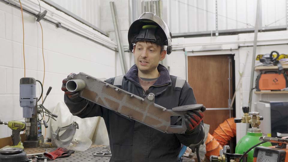 Pete admires his newly-built custom suspension like the catch-of-the-day