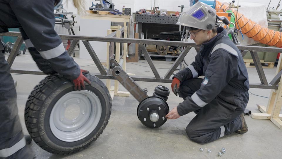 Hayley and Pete testing the suspension fits on the trailer chassis