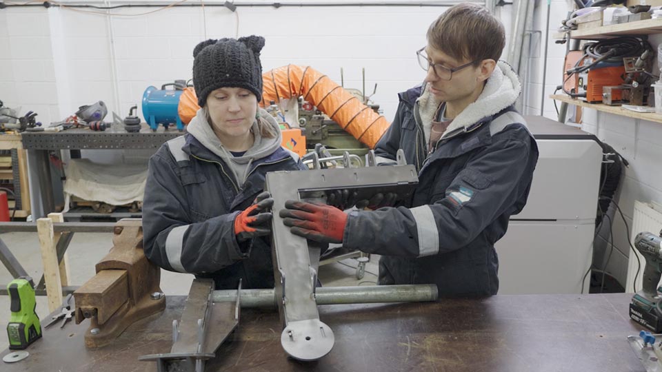 Old and new suspension arms compared