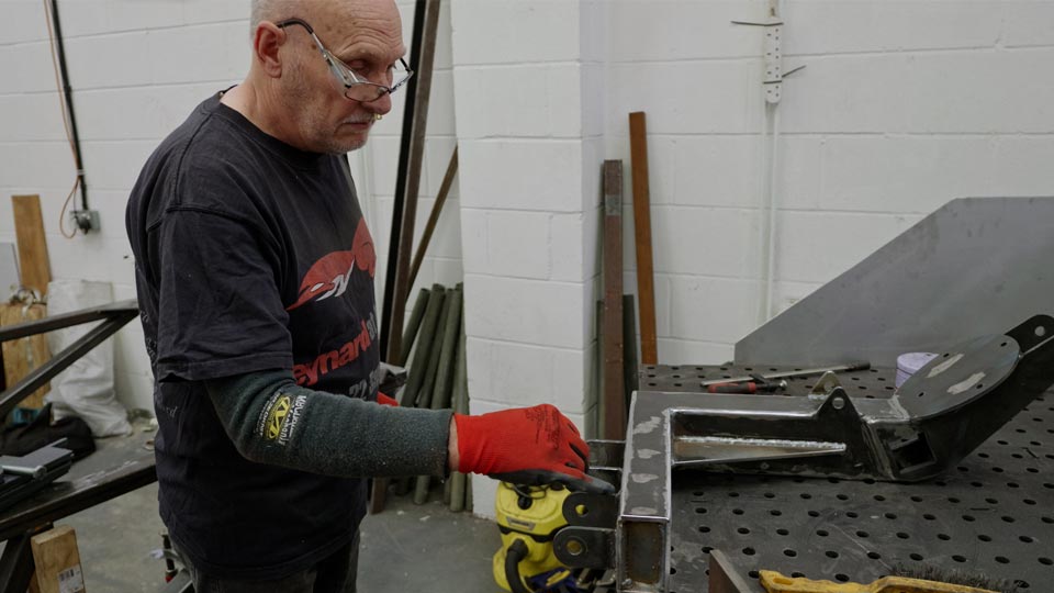 Pete's dad helps out with the suspension welding