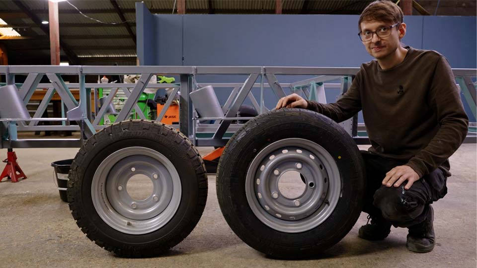 Comparing old 13" steel trailer wheel to 14" larger wheel