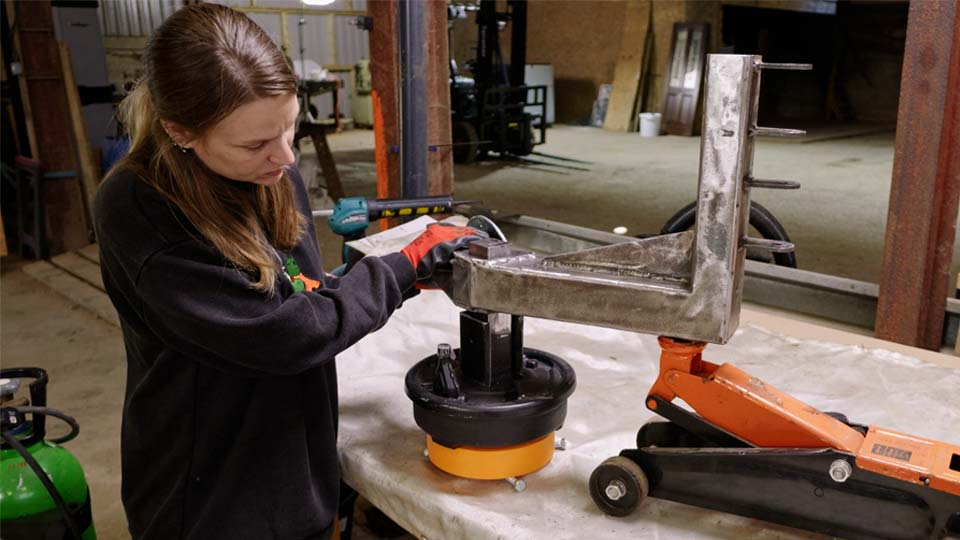 Trailer wheel alignment using a spacer